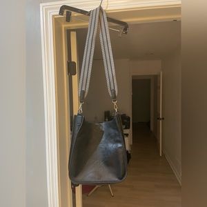 Ahdorned vegan black messenger bag with black and white crossbody strap